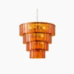 Moreland tiered glass chandelier with warm amber hand-cast glass panels in frontal studio view