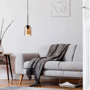 Morion amber glass pendant light in modern Nordic living room with warm Edison bulb