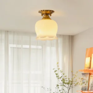 Single Morup ceiling lamp installed in modern bedroom with soft natural light from sheer curtains, mid-century lighting fixture