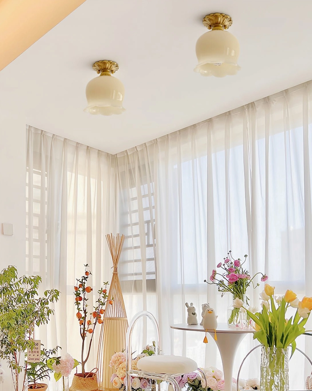 Morup ceiling lamps in sunlit dining area with plants and warm home decor, cozy vintage lighting ambiance