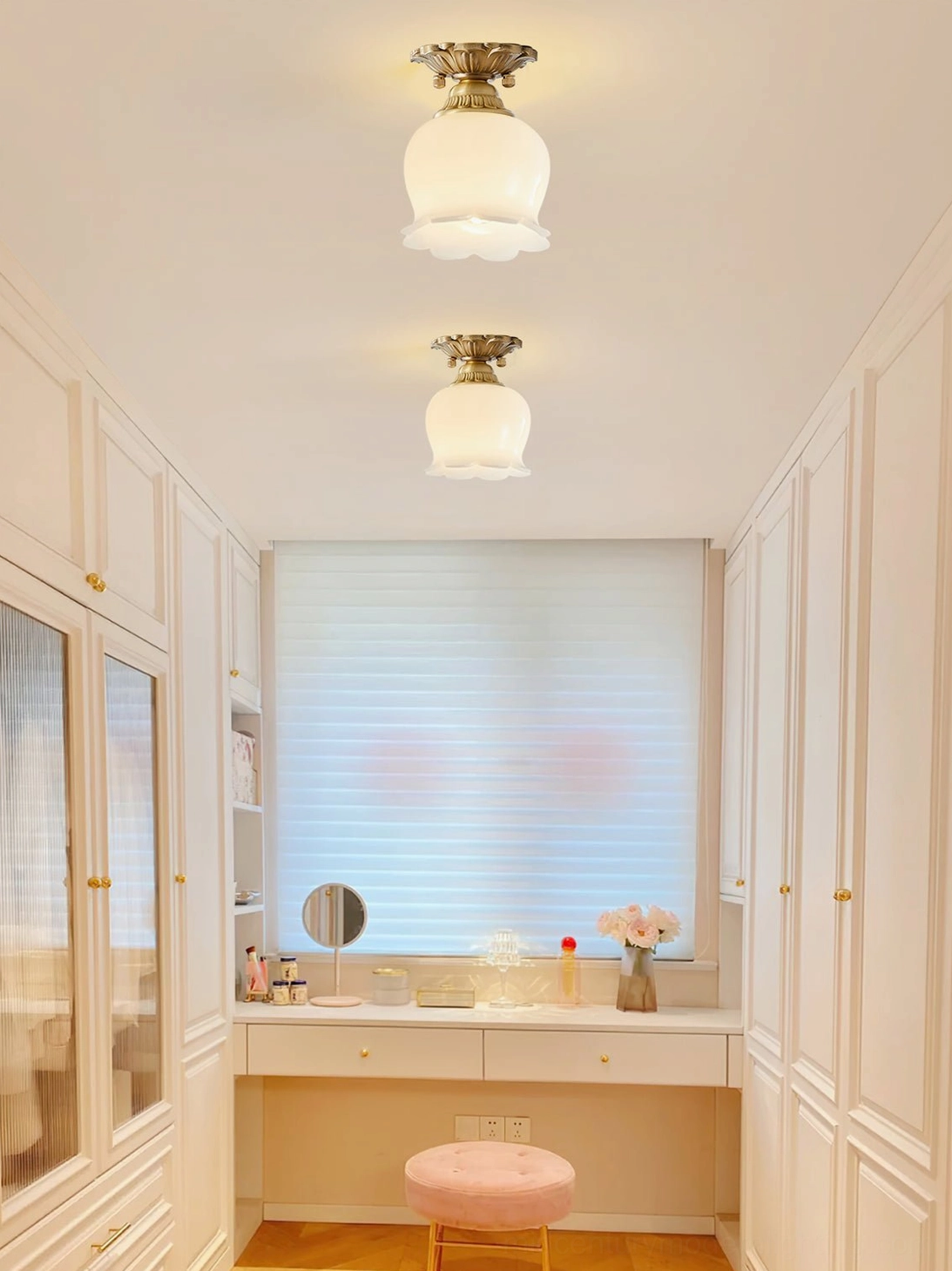 Matching Morup ceiling lamps in French dressing room vanity area, uniform retro brass and beige flush mounts