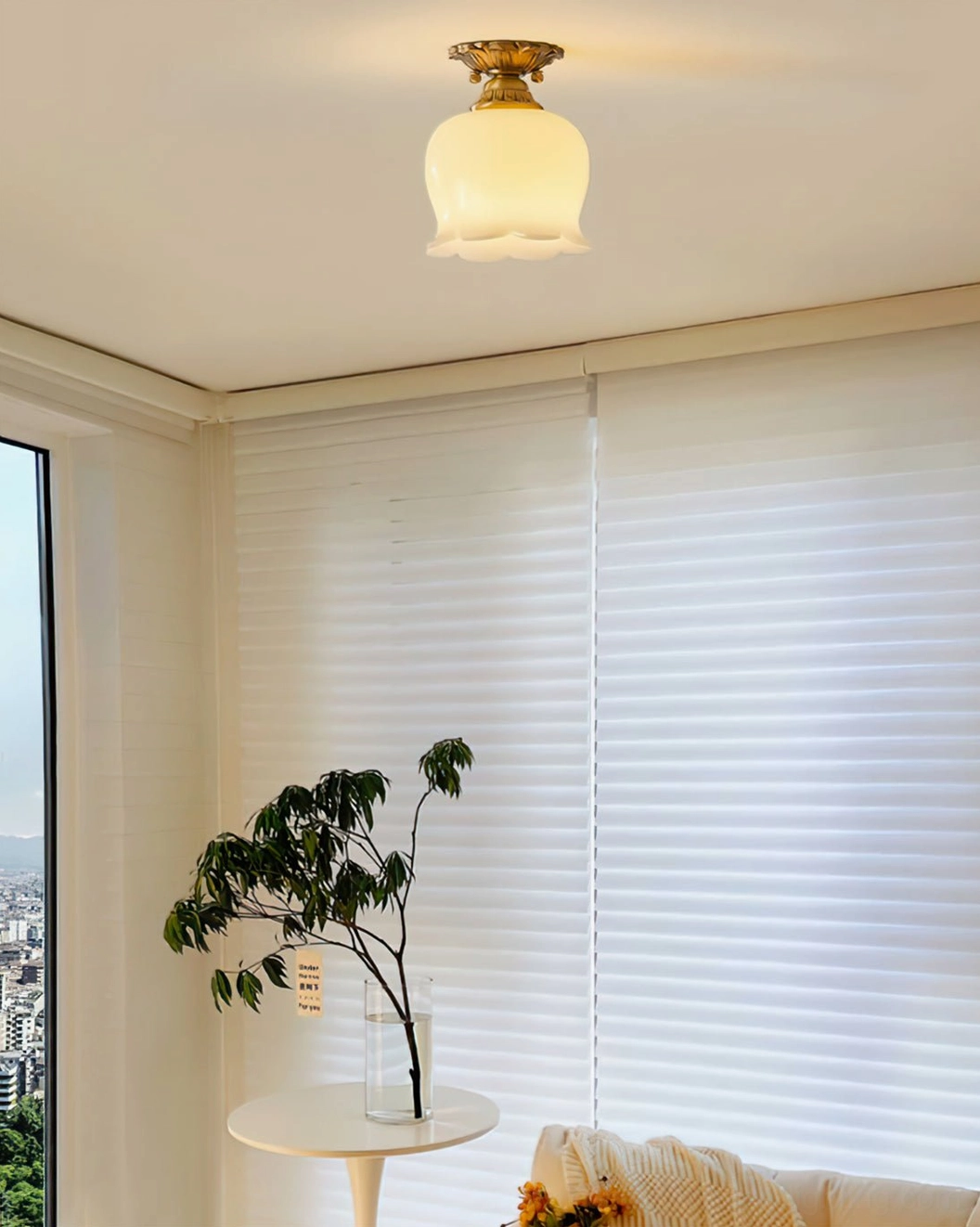 Morup ceiling lamp with flower-shaped glass shade in sunlit living room corner with vintage ambiance