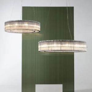 Dual Mossi glass chandeliers eye-level perspective modern dining room with green accent wall matte black and clear glass contemporary design