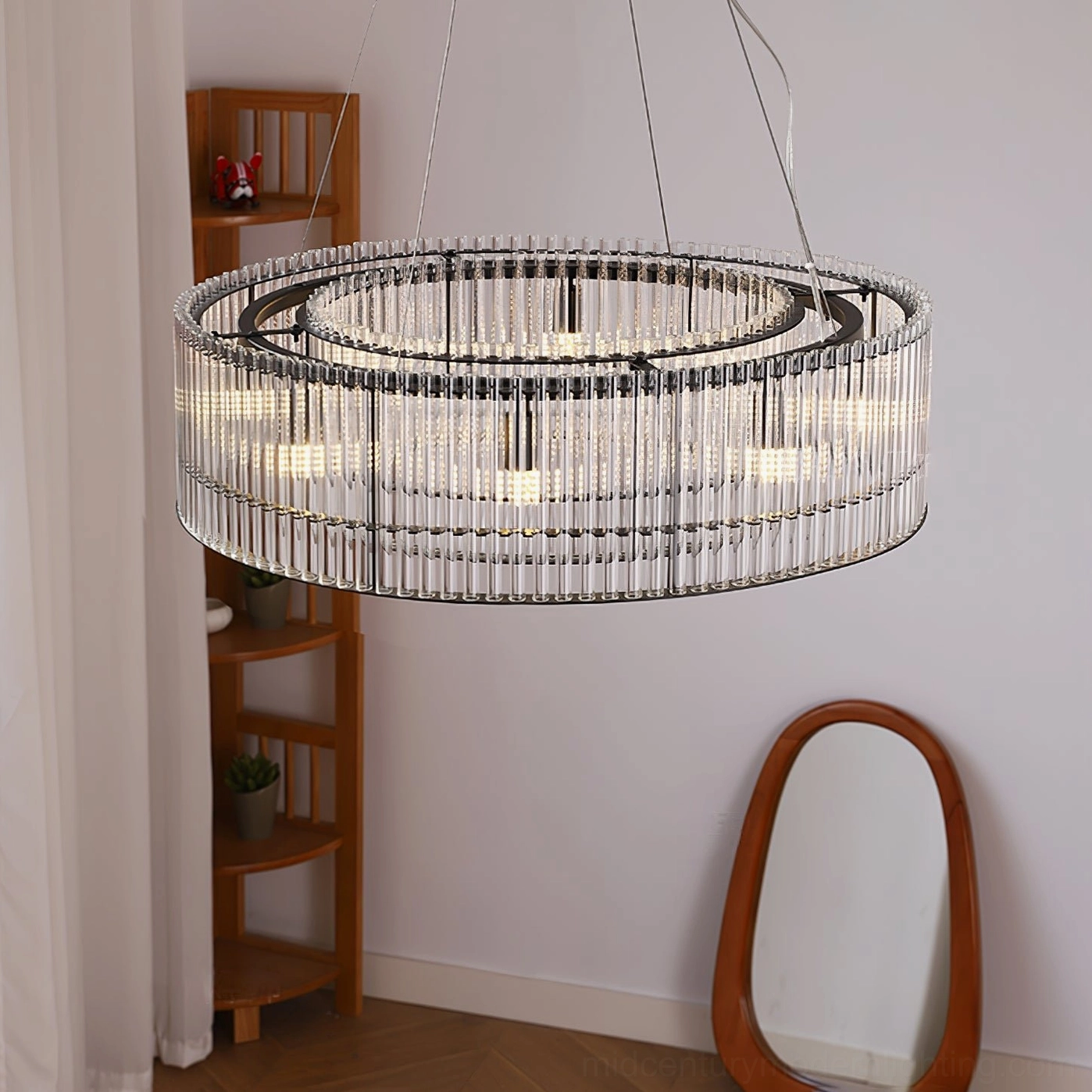 Large Mossi glass chandelier entryway three-quarter view wooden shelf oval wall mirror modern luxury black metal frame glass tubes