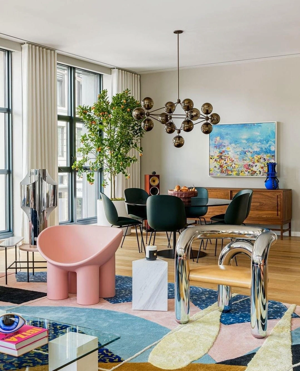 Moto sputnik chandelier in eclectic modern apartment with colorful rug and accent furniture