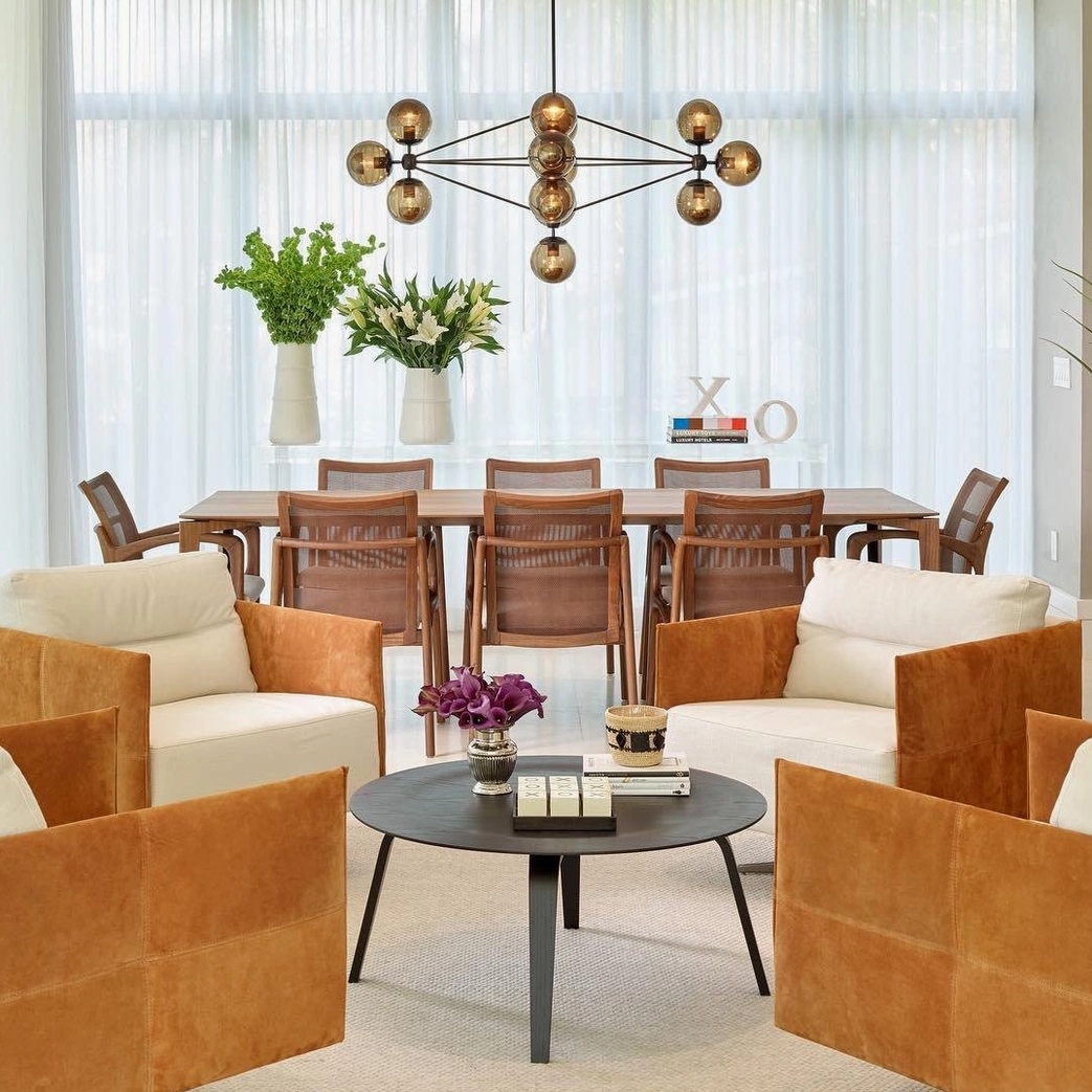 Overhead view of Moto sputnik chandelier in open concept living-dining area with brown sofas