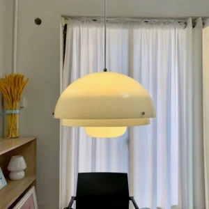 Motown pendant lamp warm light illuminating contemporary home study with shelving and natural textures