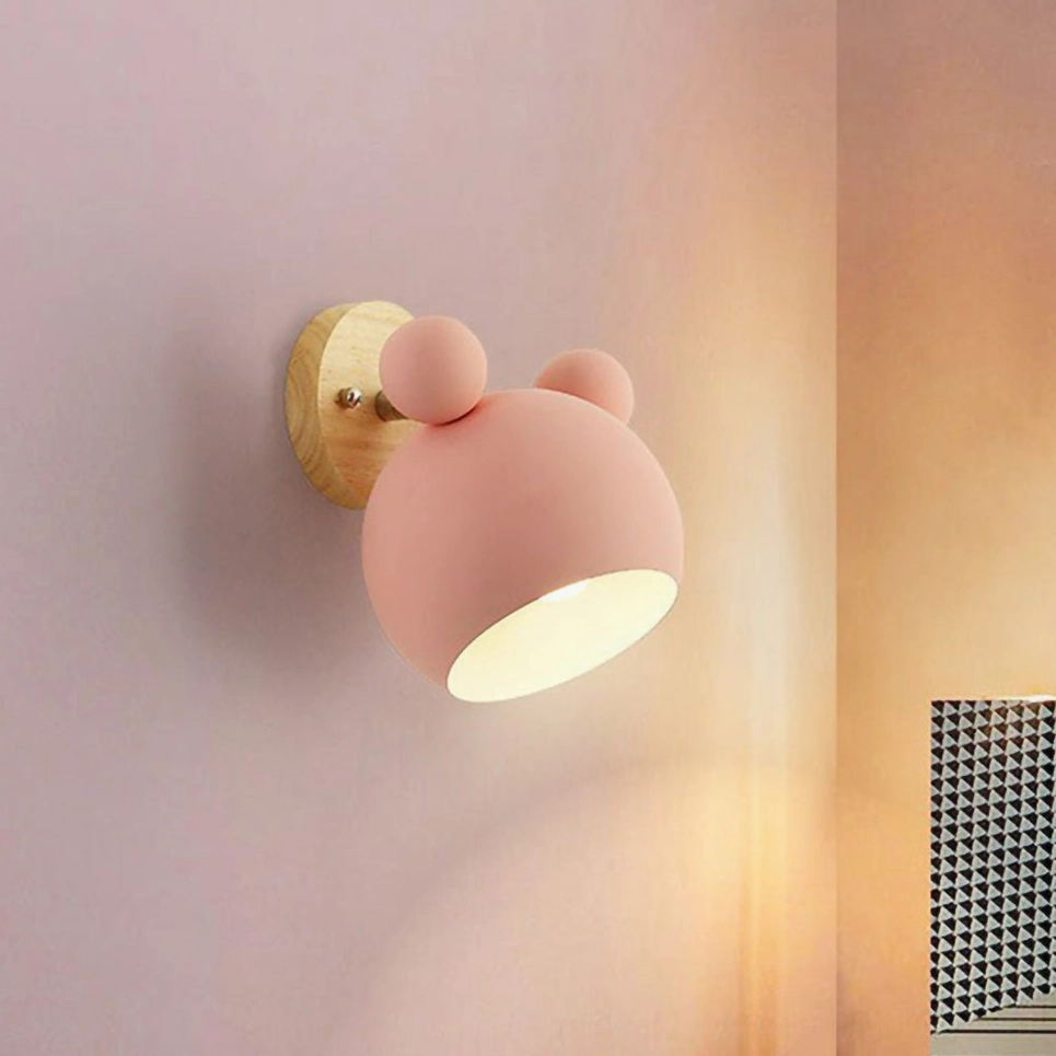 Multiple mouse sconces in different colors gallery wall effect playful design