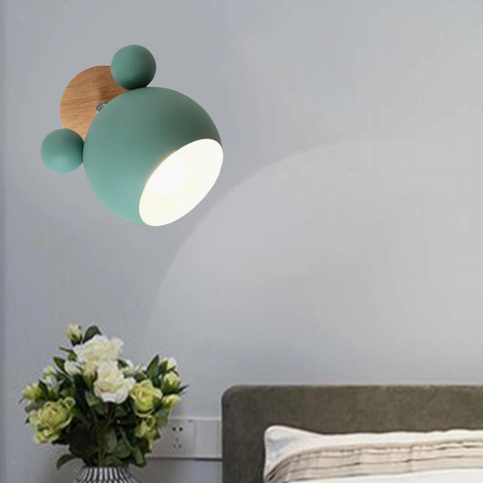 Mouse sconce with LED bulb installation showing energy-efficient lighting performance