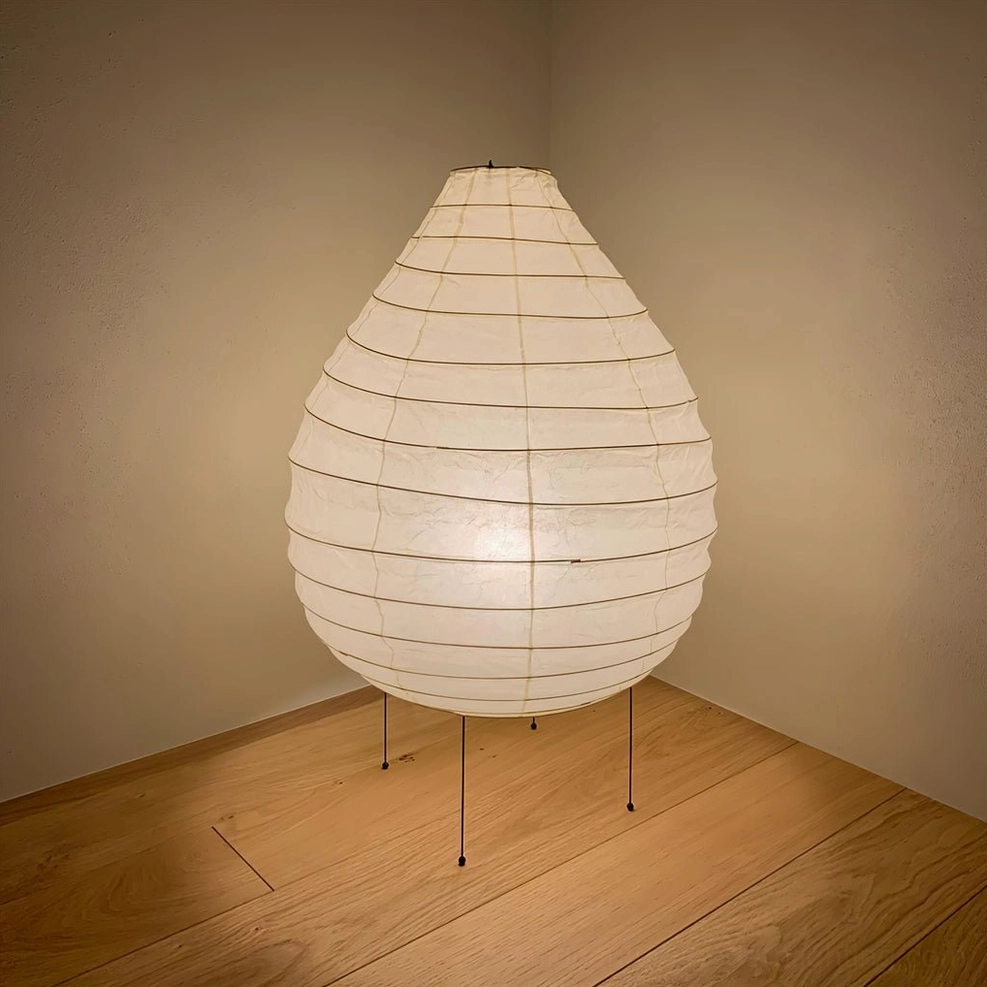 Sculptural mulberry paper table lamp anchoring console or sideboard in minimalist interior