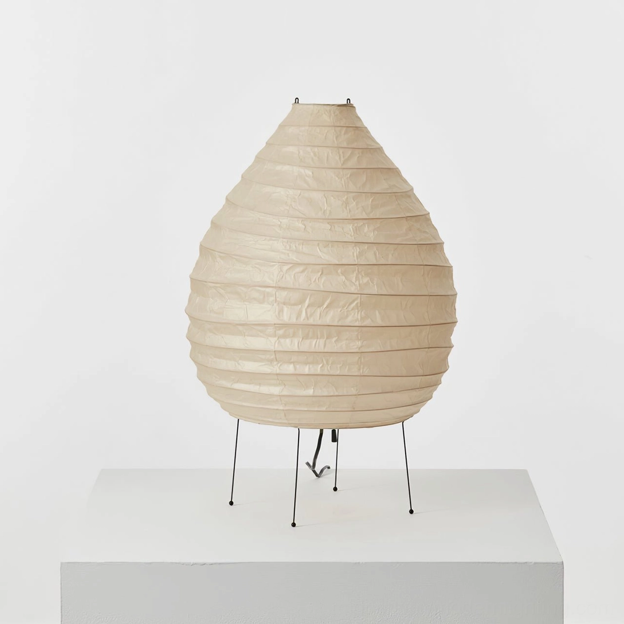 Mulberry paper lamp with folded washi shade and slim iron frame, product detail view