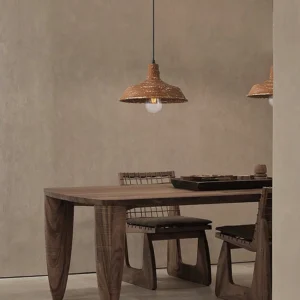 Mulino hand-finished pendant lamp pair suspended over rustic wooden dining table with warm glowing light