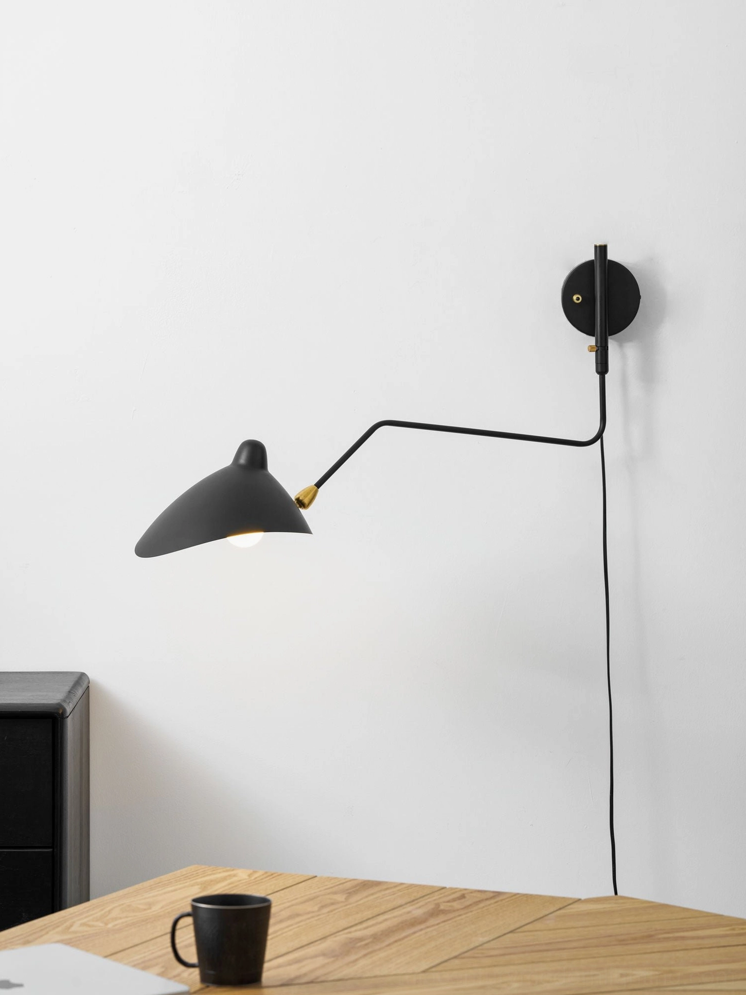 Adjustable multi-arm wall sconce showing independent movement of each articulating head