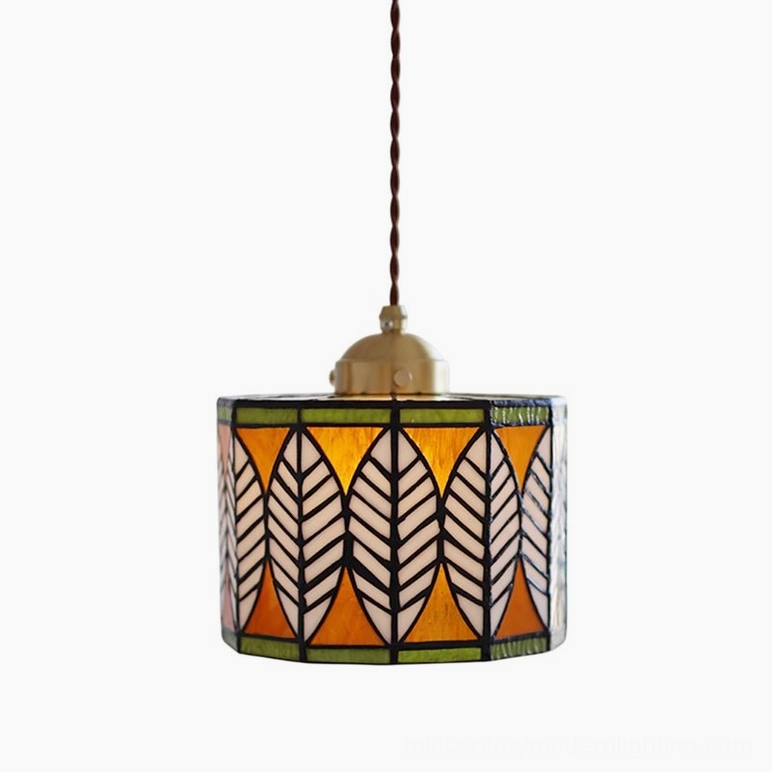 Multi-color leaf Tiffany pendant in orange-red, green, and gold stained glass, hanging display