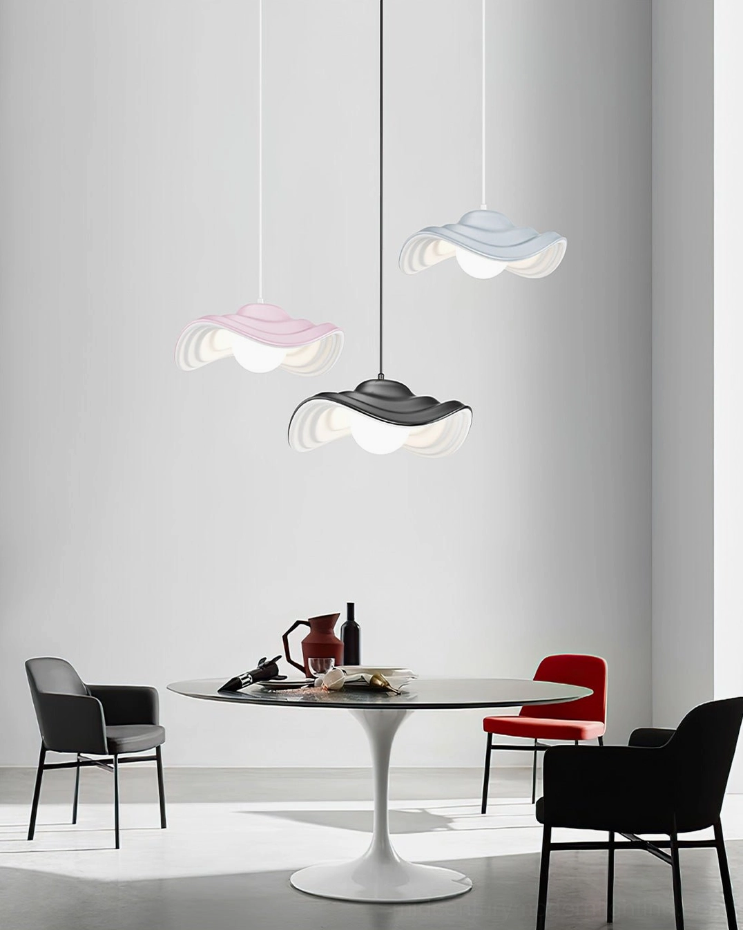 Collection of Visilica pendant lights in multiple colors - black, grey, and pink wavy design - displayed in modern dining room setting