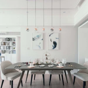 Multi-head spherical pendant light set in modern dining room with Nordic minimalist interior aesthetic