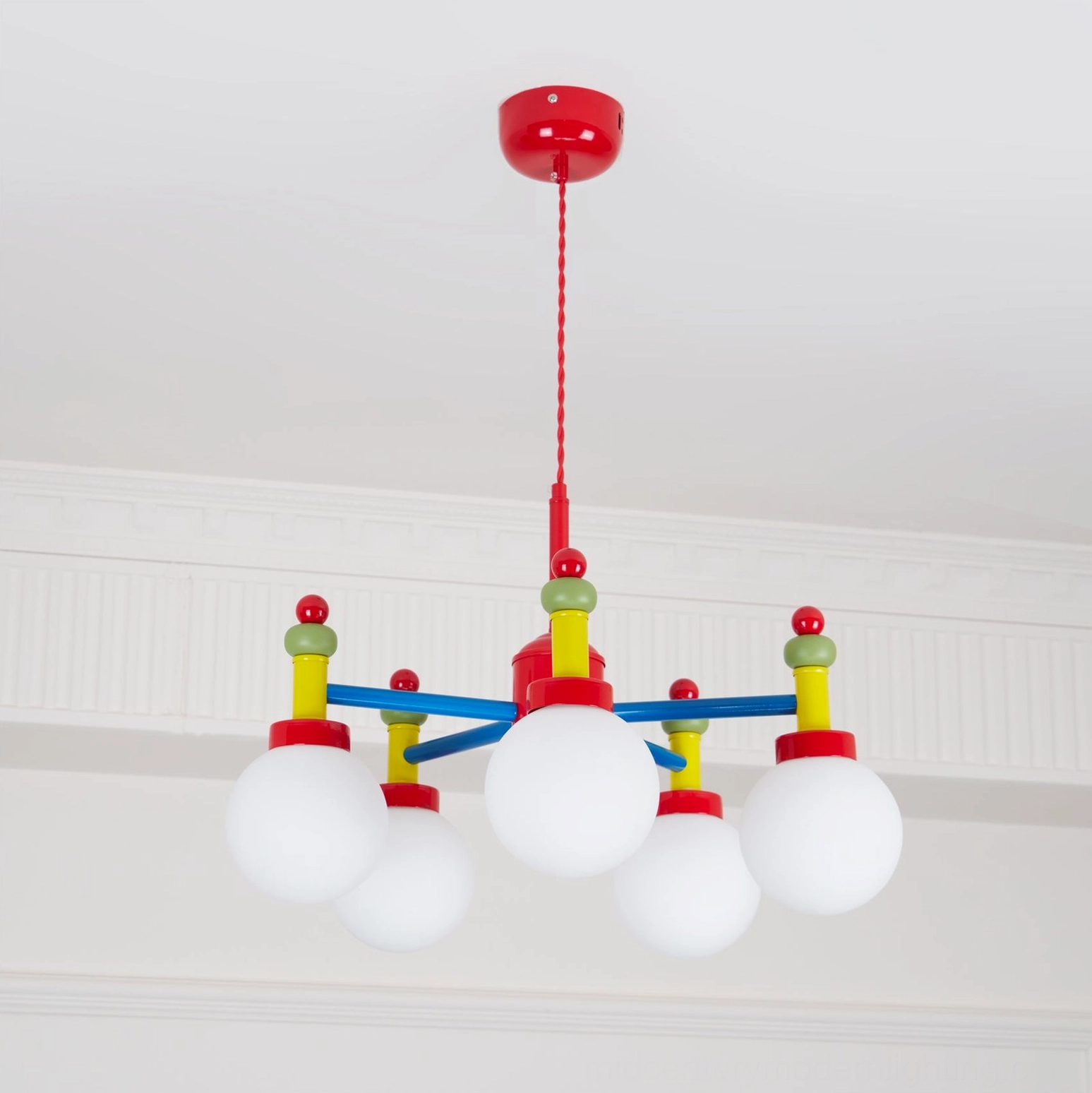 Multi-head pendant lamp showing glass shade construction and metal frame assembly