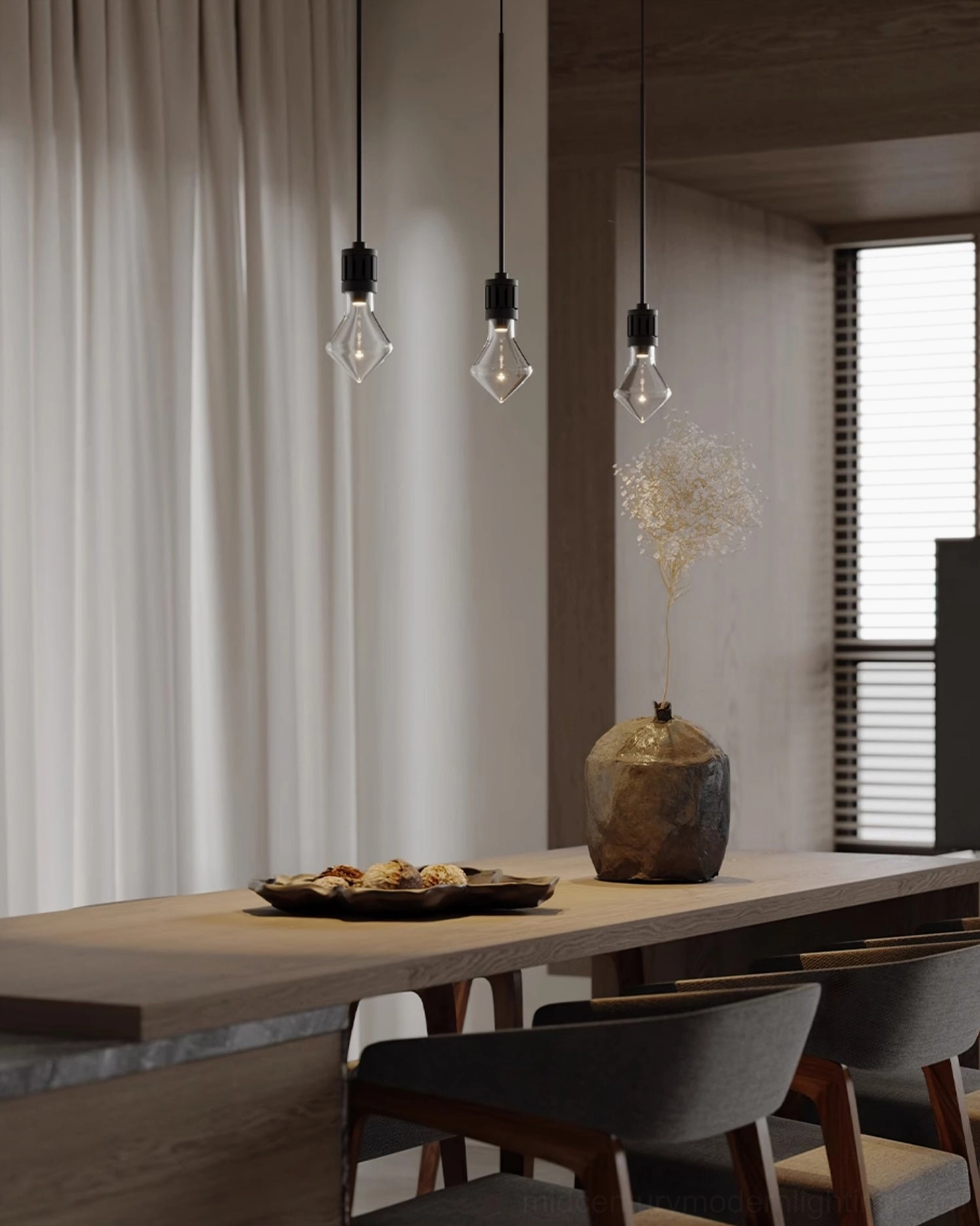 Three diamond glass pendant lights clustered above modern wooden dining table in warm-toned dining room setting