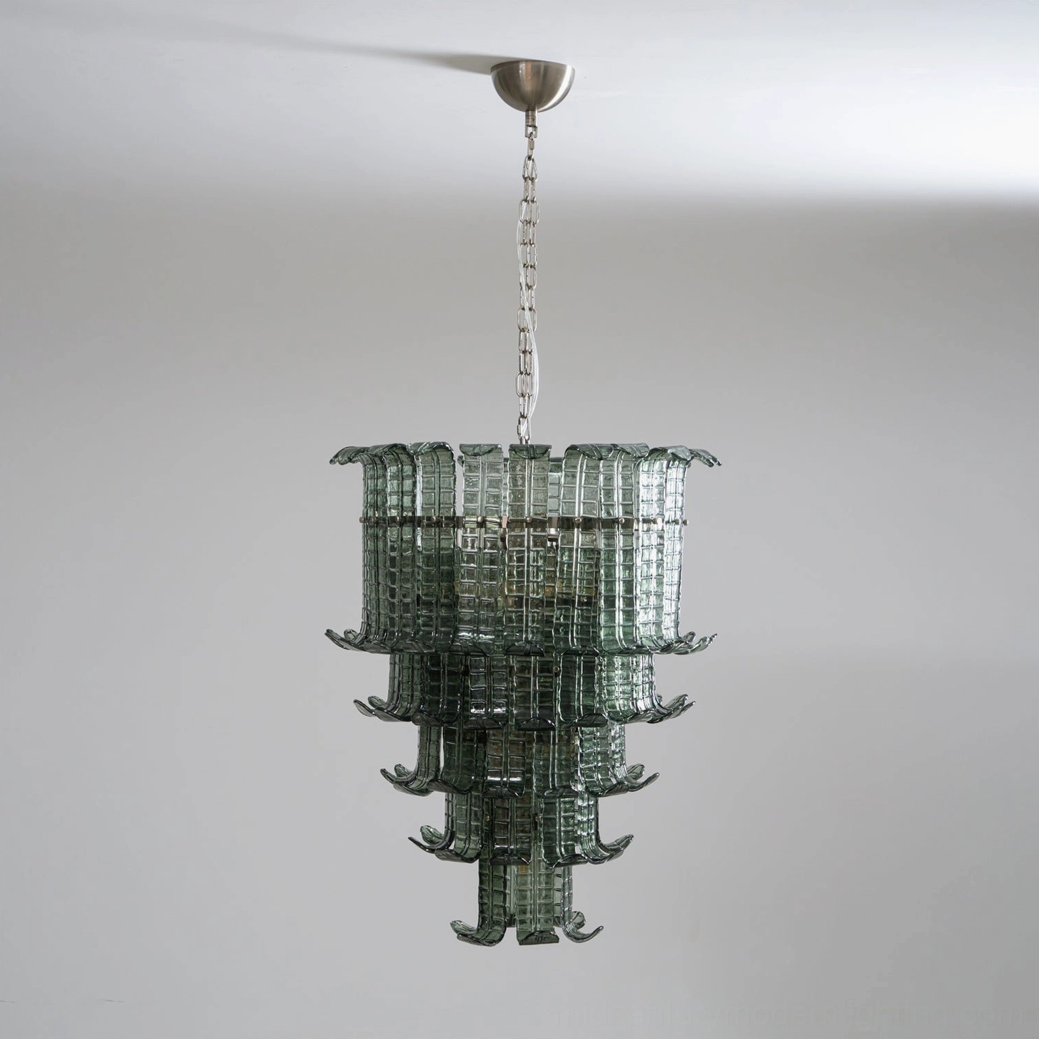 Murano tiered glass chandelier detailed architectural view showing cascading layers, glass refraction patterns and polished metal framework