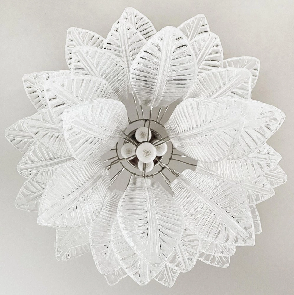 Front close-up of Murano glass chandelier showing radial 3D layered leaf glass design and central light base construction