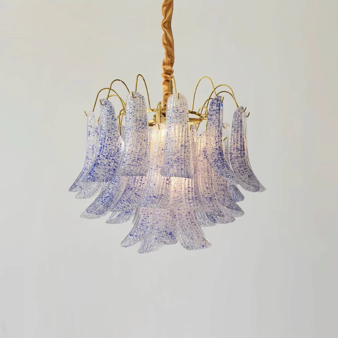 Blue Murano glass chandelier with cool sapphire and sky tone speckling in contemporary living space