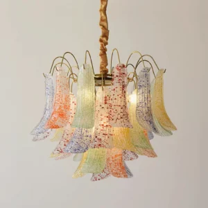 Low angle detail of Murano glass chandelier showing pastel speckled flared glass shades with twisted brass rod