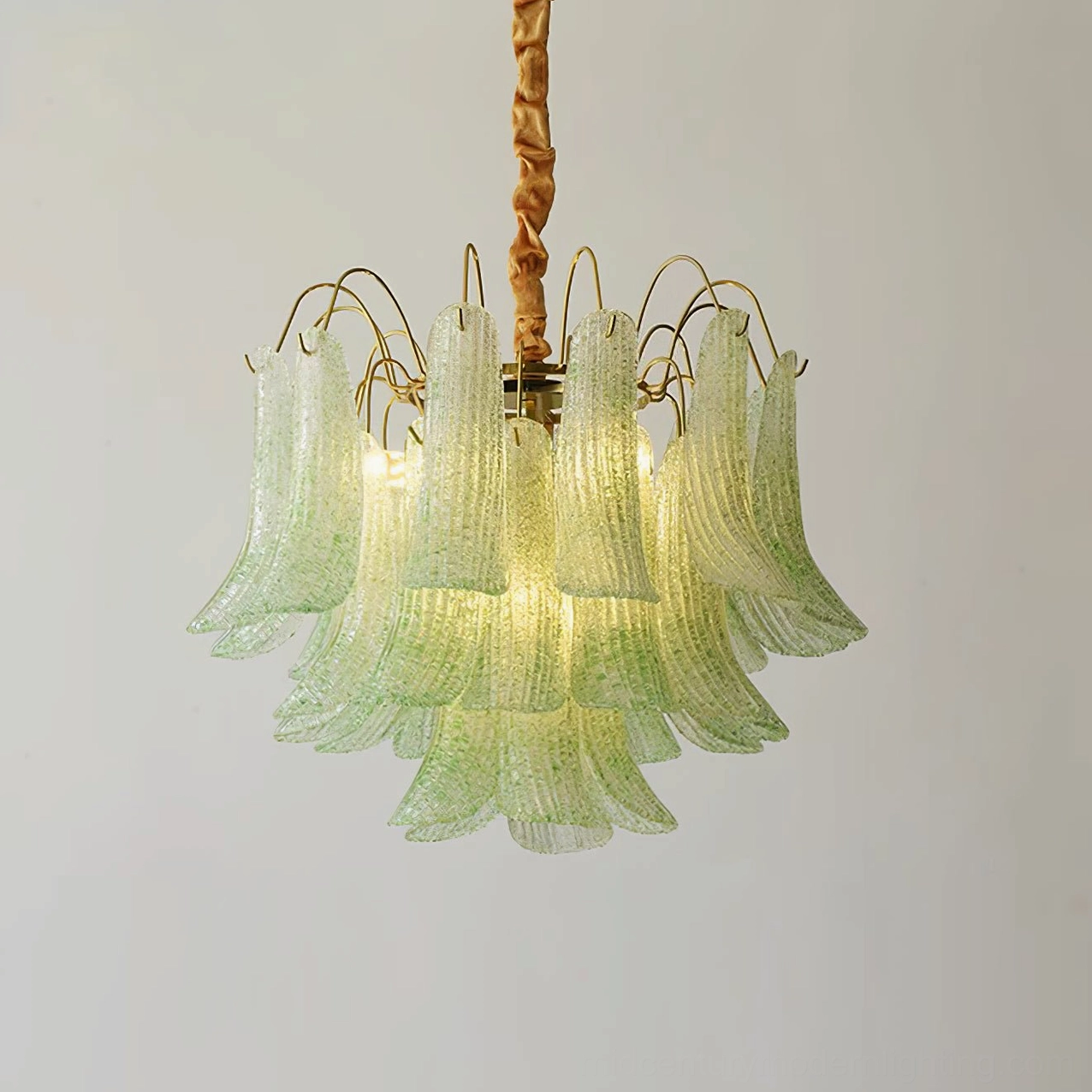 Green Murano glass chandelier with soft sage forest tones complementing botanical design aesthetic
