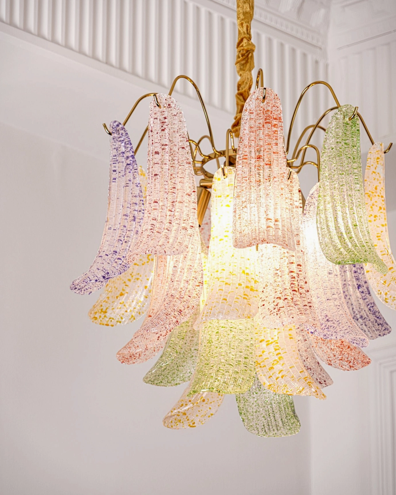 Murano glass chandelier in eclectic maximalist interior showcasing vibrant multicolor glass palette