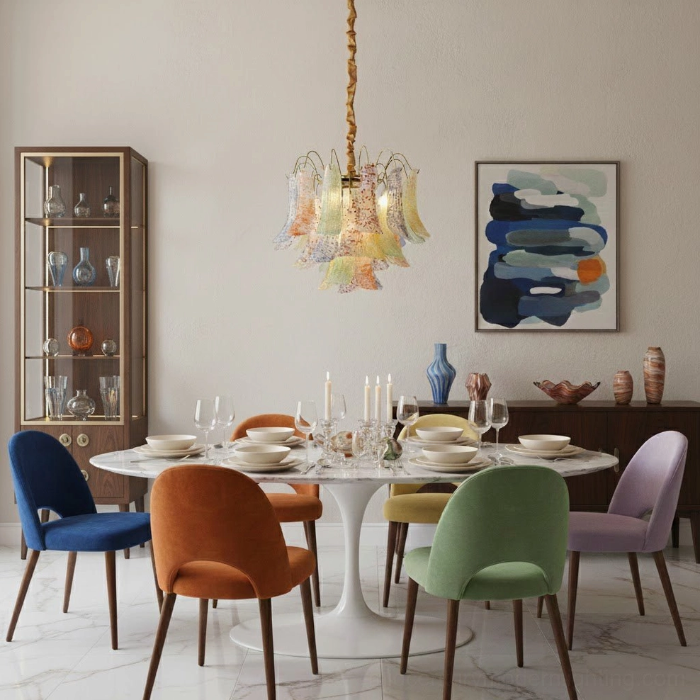 Overhead view of Murano glass chandelier in minimalist bright dining area with pastel glass shades and colorful accent chairs