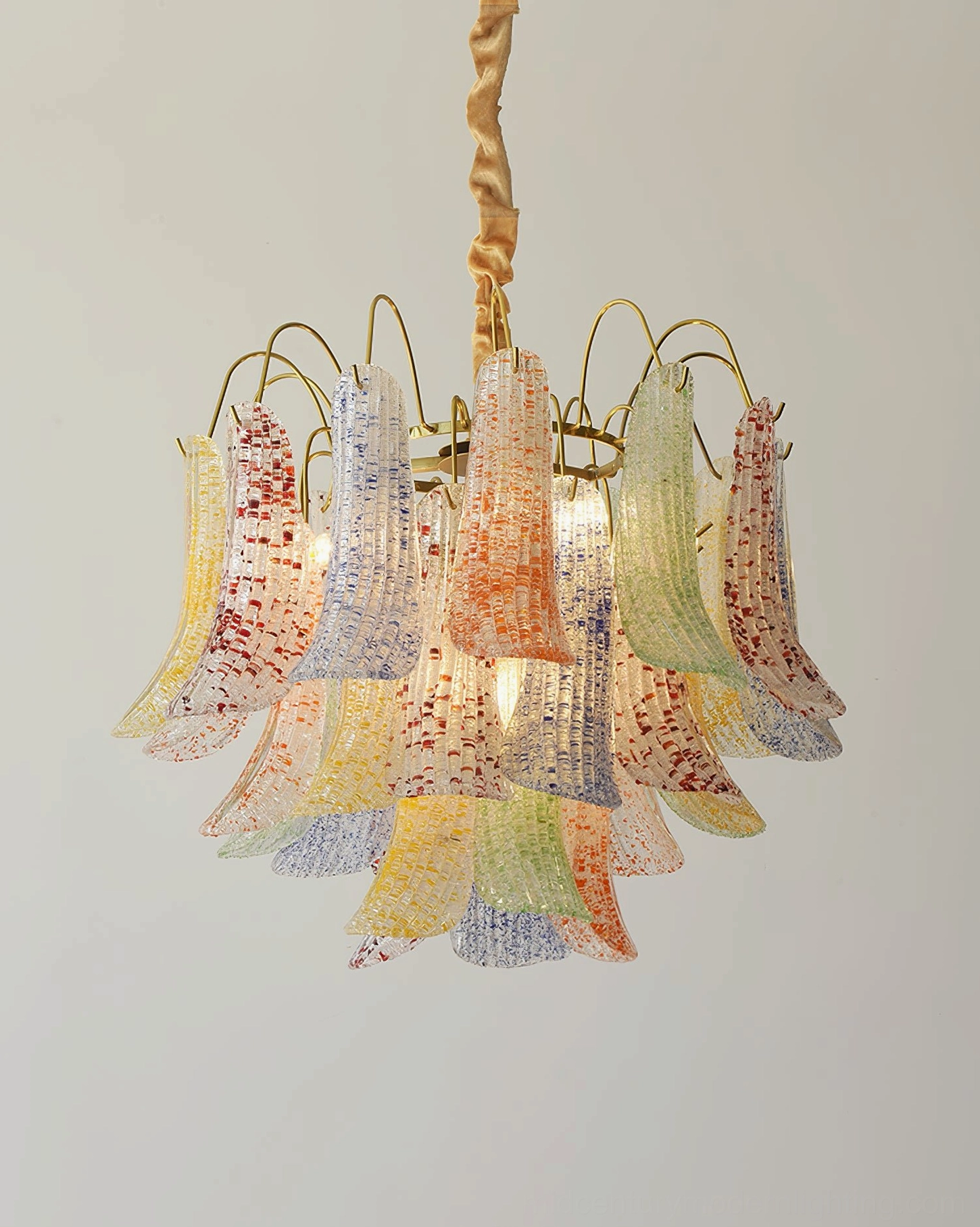 Murano glass chandelier casting warm ambient glow with individual glass leaf shadow patterns on ceiling