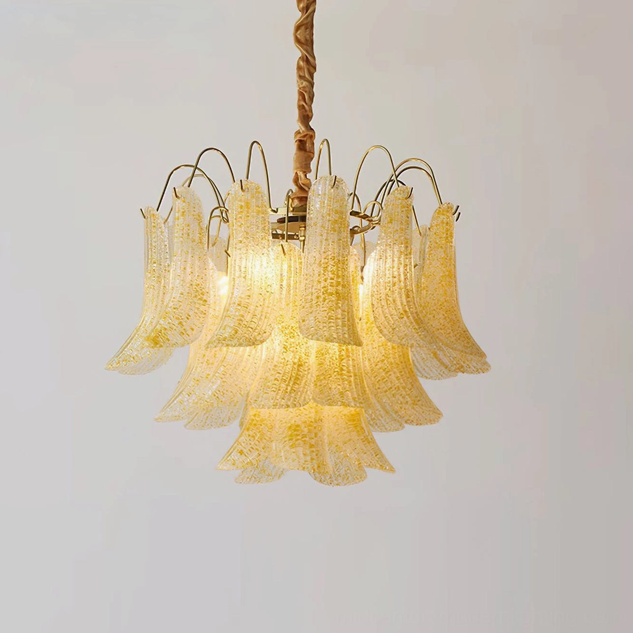Yellow golden Murano glass chandelier with warm amber tones in retro vintage home interior