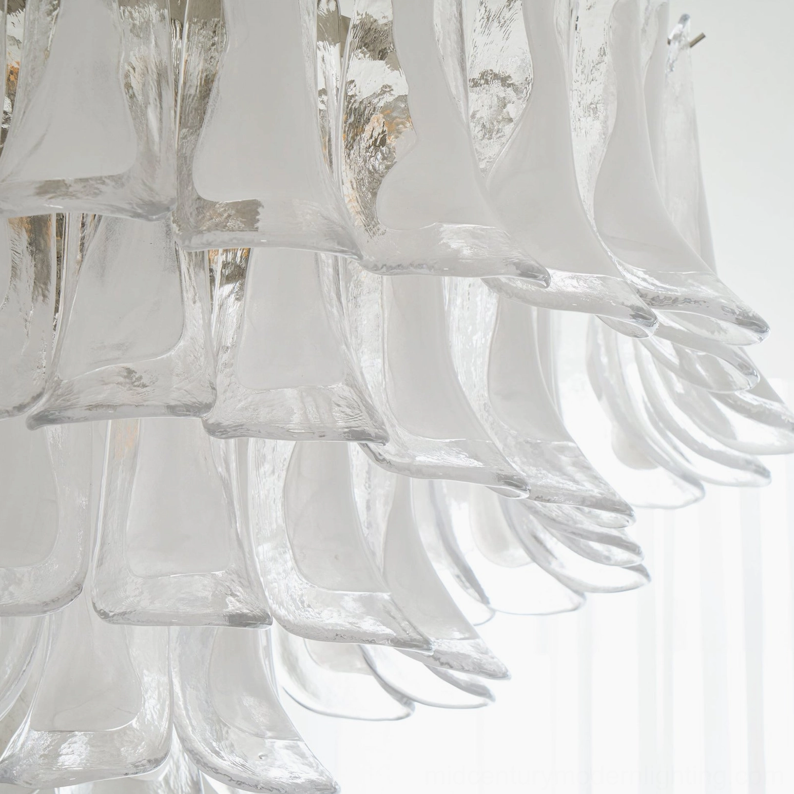Close-up detail of thick hand-blown Murano glass petals with glossy curved finish and light refraction