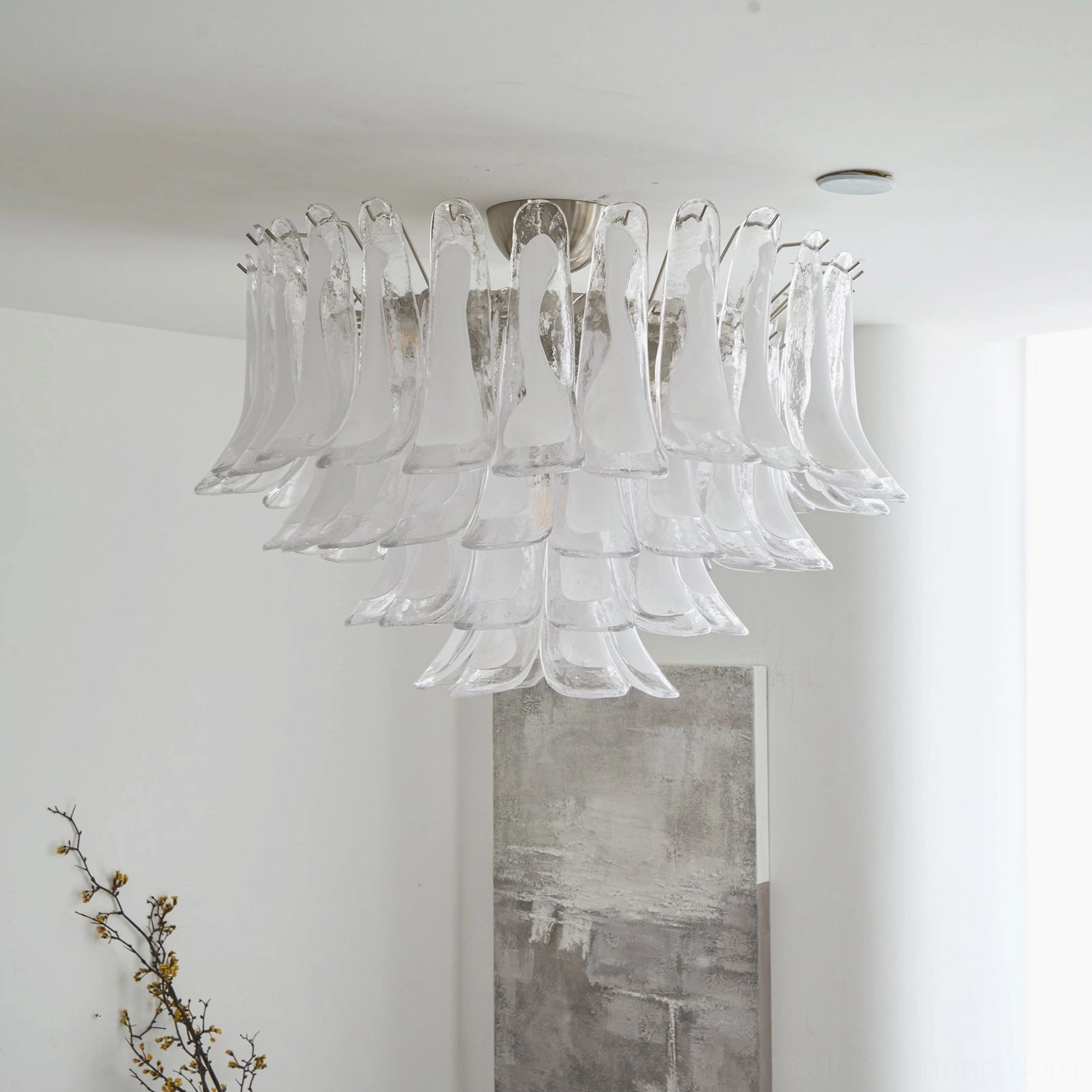 Modern Murano glass petal ceiling light installed in minimalist white interior, showing cascading glass layers and soft ambient glow