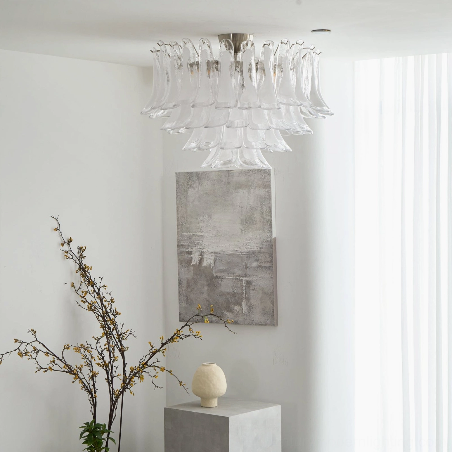 Murano Petal chandelier mounted in bright minimalist interior, side wide view showing layered glass and nickel base