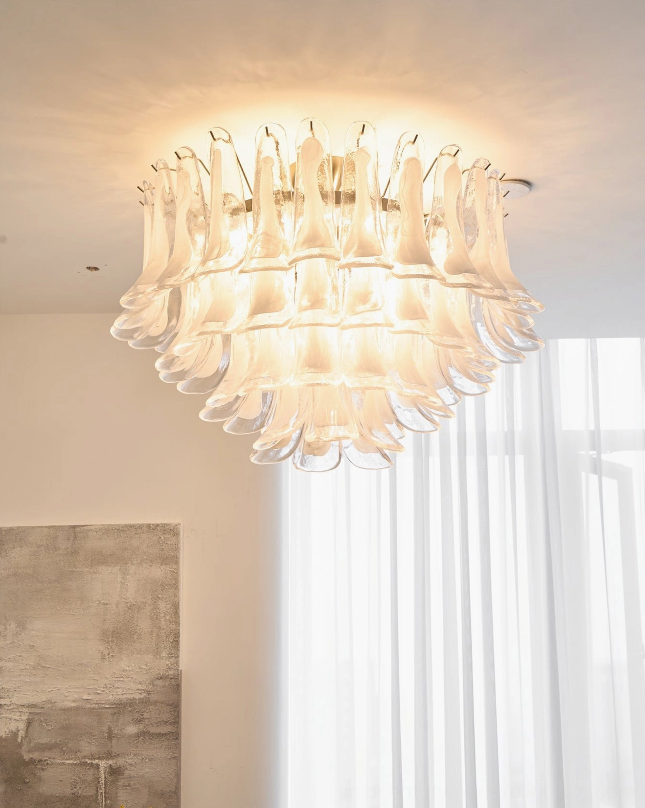 Contemporary Murano Petal glass ceiling chandelier in bright modern living room, stacked clear glass petal design