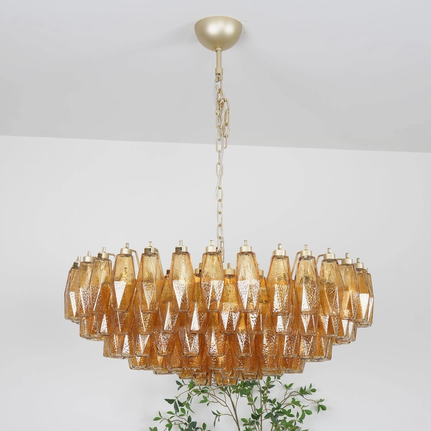 Hand-blown amber Murano glass chandelier showing detail of individual rhombus pieces and metal suspension