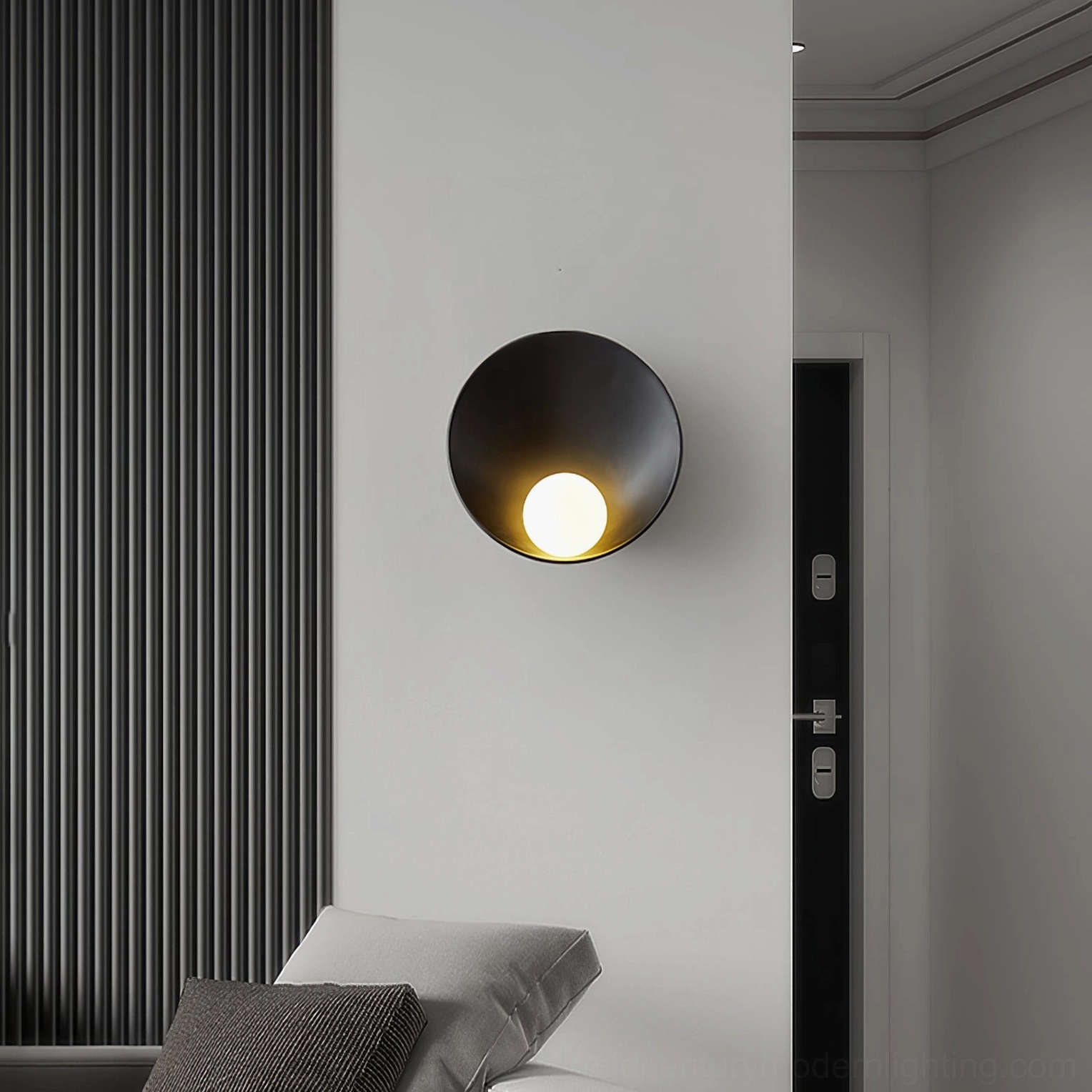Black Musa wall sconce installed on modern bedroom entryway wall in minimalist interior design