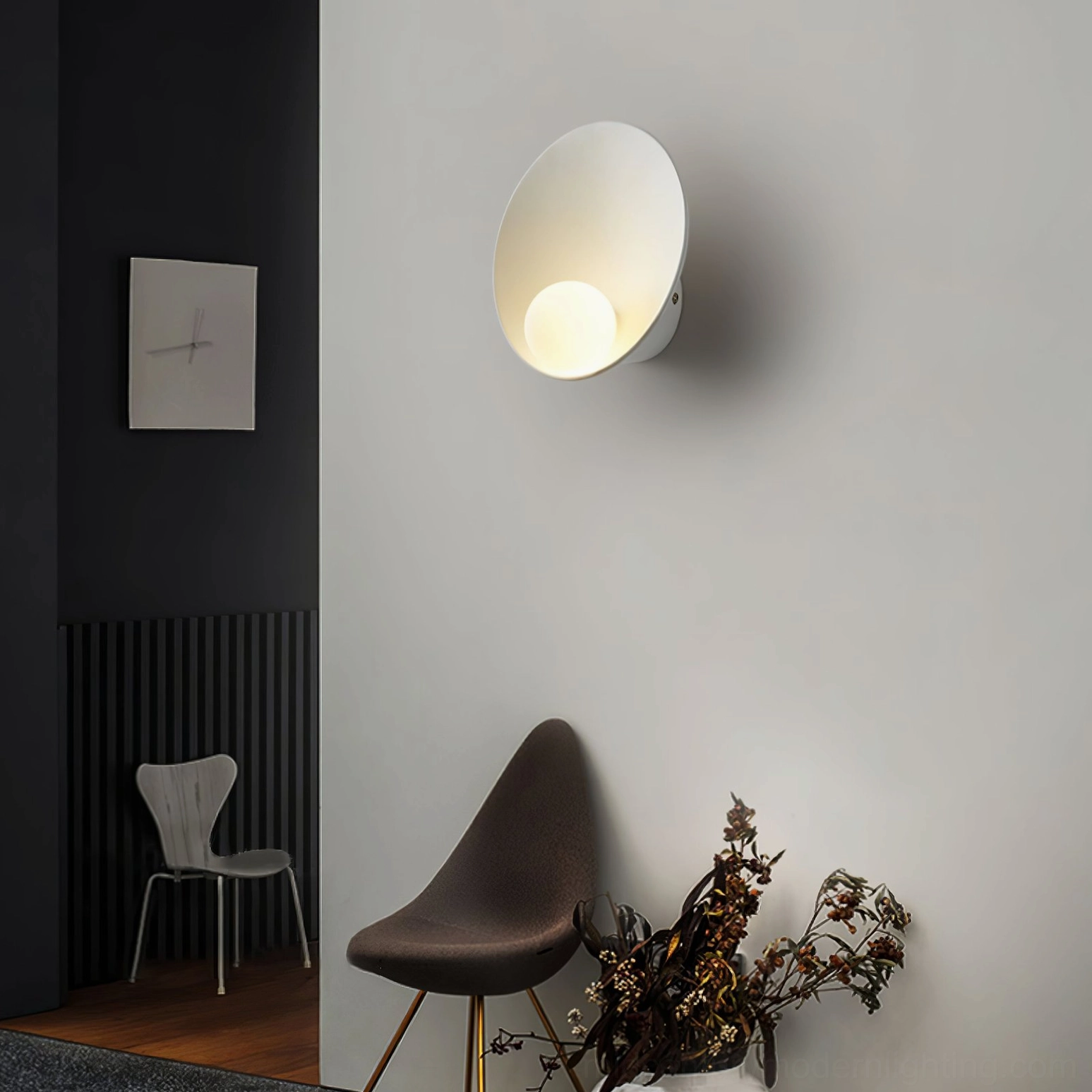 Musa organic sconce showing curved dish morphology that distributes light naturally without harsh spots