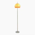 Vintage mushroom floor lamp with silver metal base and brown glass dome shade, studio front view