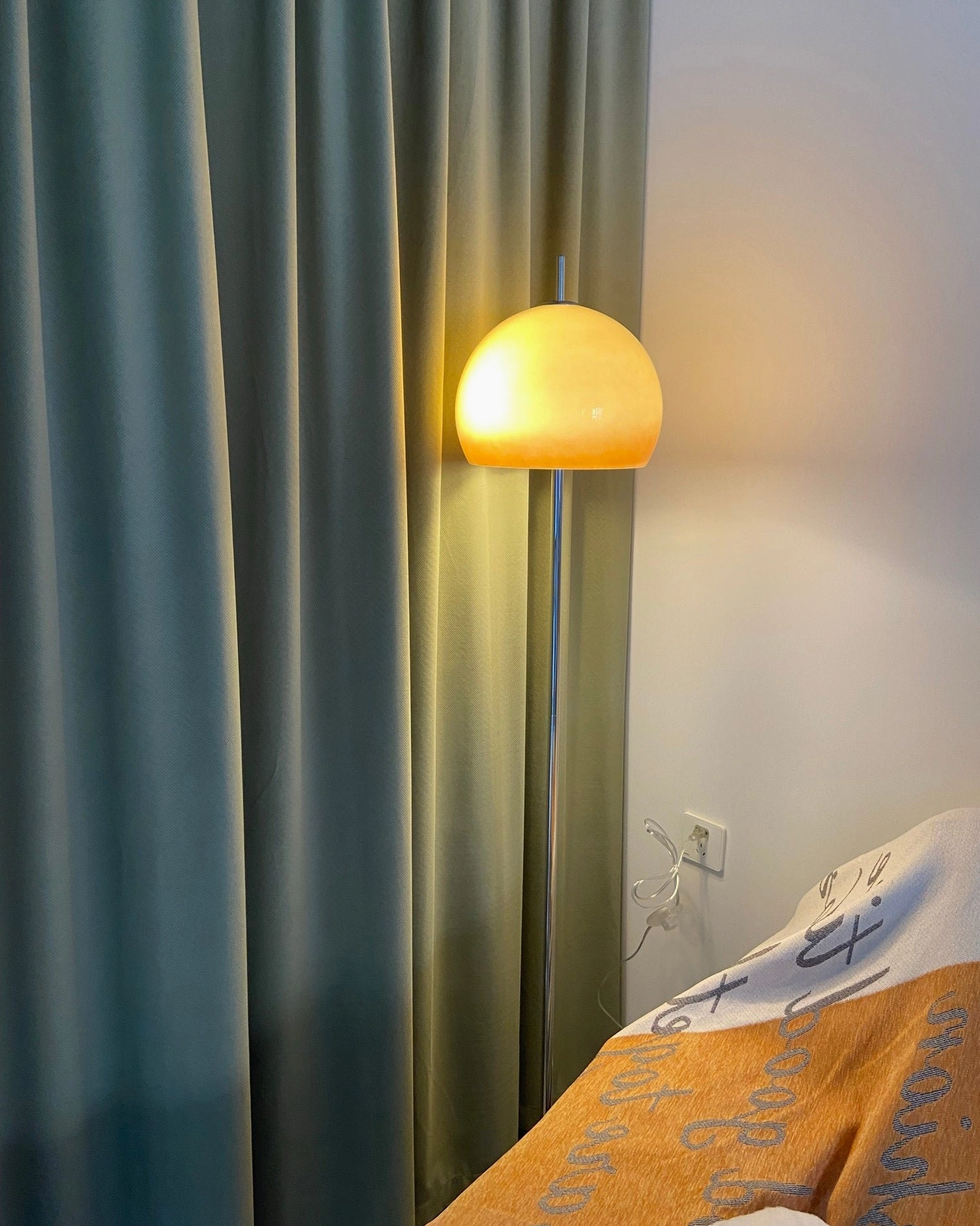 Mushroom floor lamp positioned for optimal room lighting in living area
