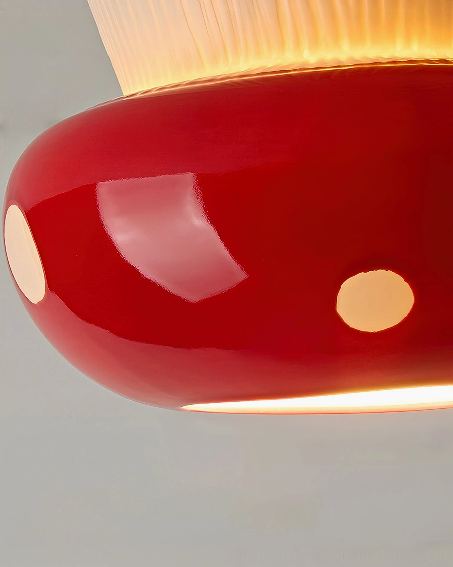 Extreme close-up of red mushroom cap surface showing high-gloss finish and textured ceramic detailing