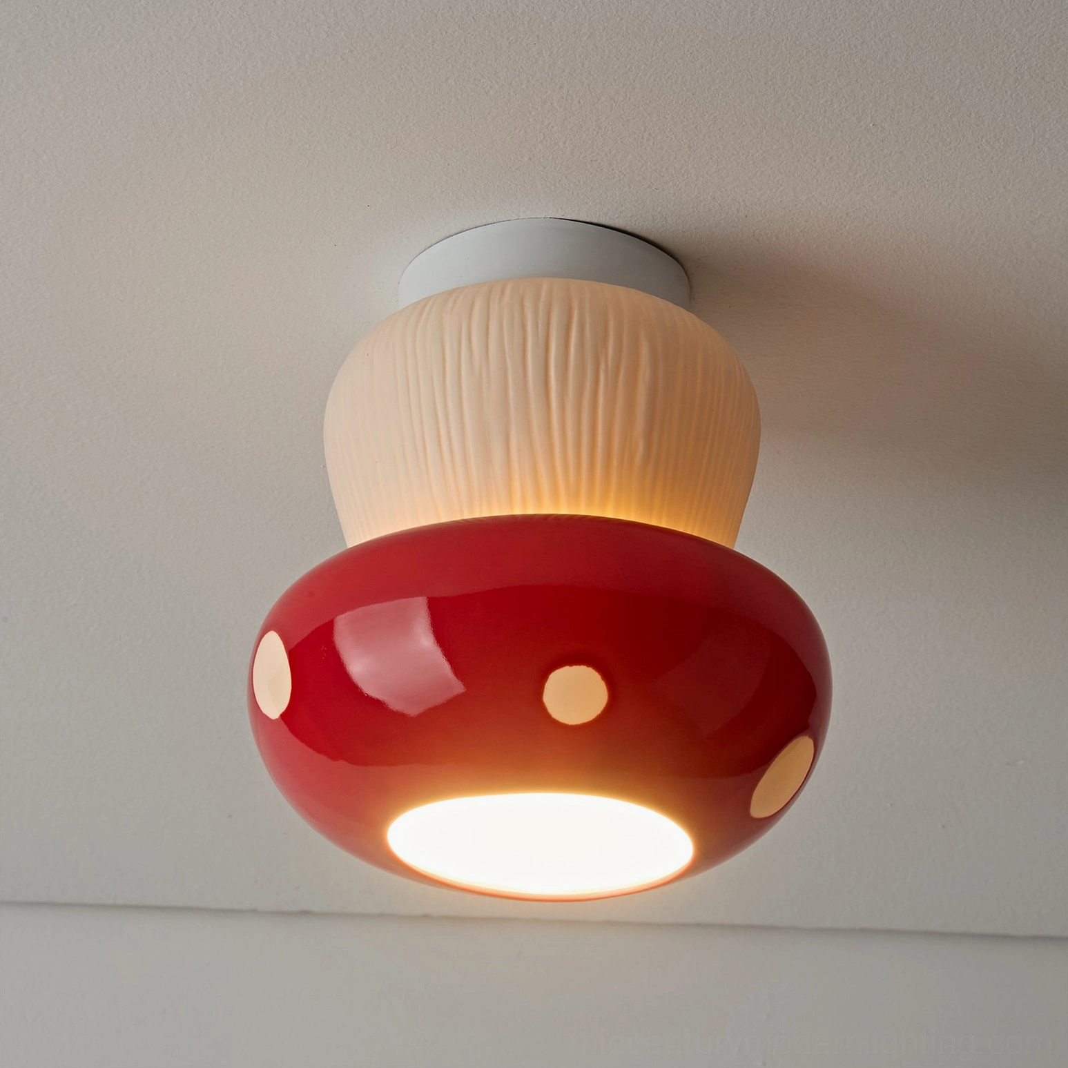 Mushroom ceiling light installed in creative studio space creating whimsical ambiance