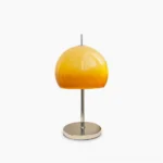 Vintage mushroom table lamp with amber gradient acrylic dome shade and chrome metal base, front studio view