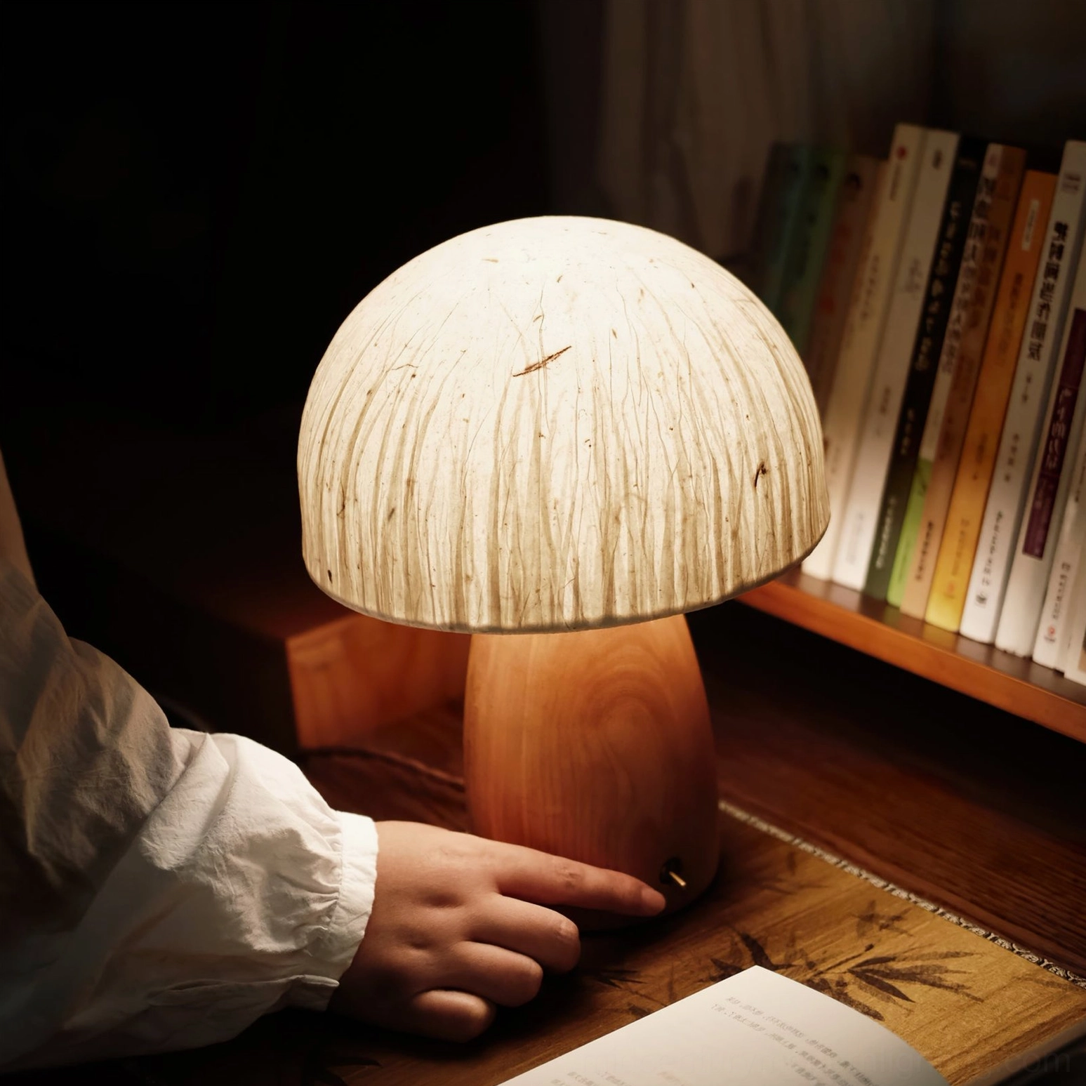 Mushroom lamp creating soft diffused light on home office desk with minimalist aesthetic