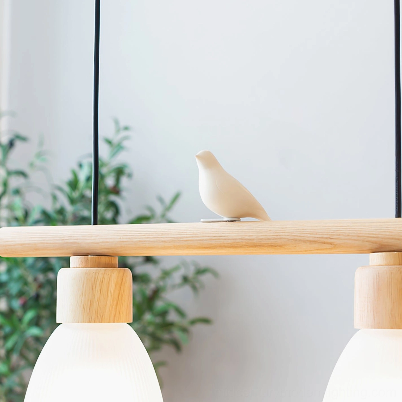 Muto Bird Chandelier close-up macro - single bird ornament detail on white resin with natural wood accent