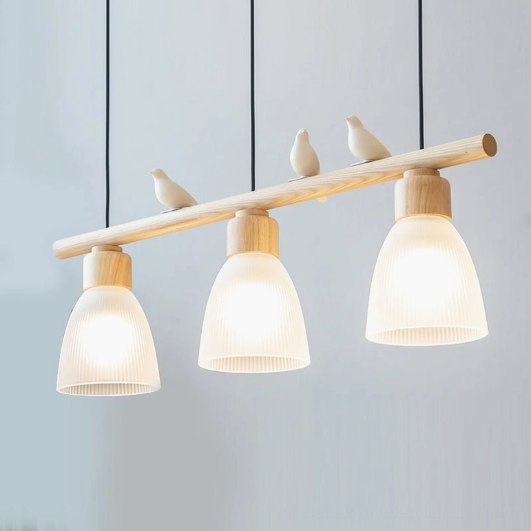 Muto Bird Chandelier lit view - 3-head pendant with warm ambient light and natural wood finish