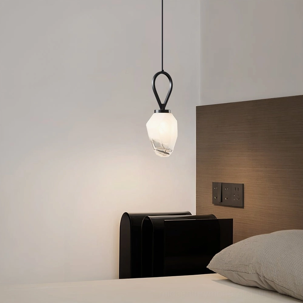 Black Myla pendant hanging in master bedroom over bed, modern neutral minimalist bedroom lighting solution