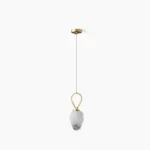Myla faceted glass pendant light with gold brass hardware, studio overhead view showing geometric glass shade and minimalist design