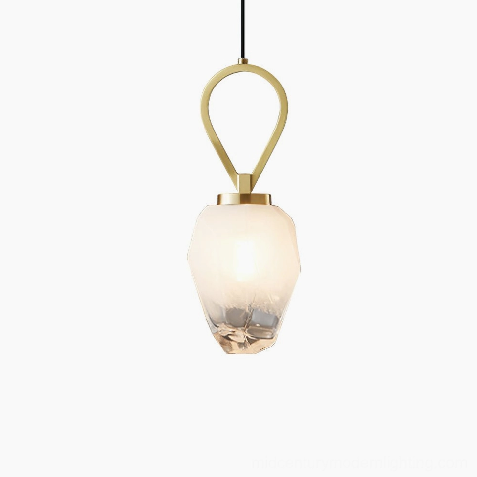 Myla pendant light with brass accents and frosted glass shade, studio product photography overhead angle