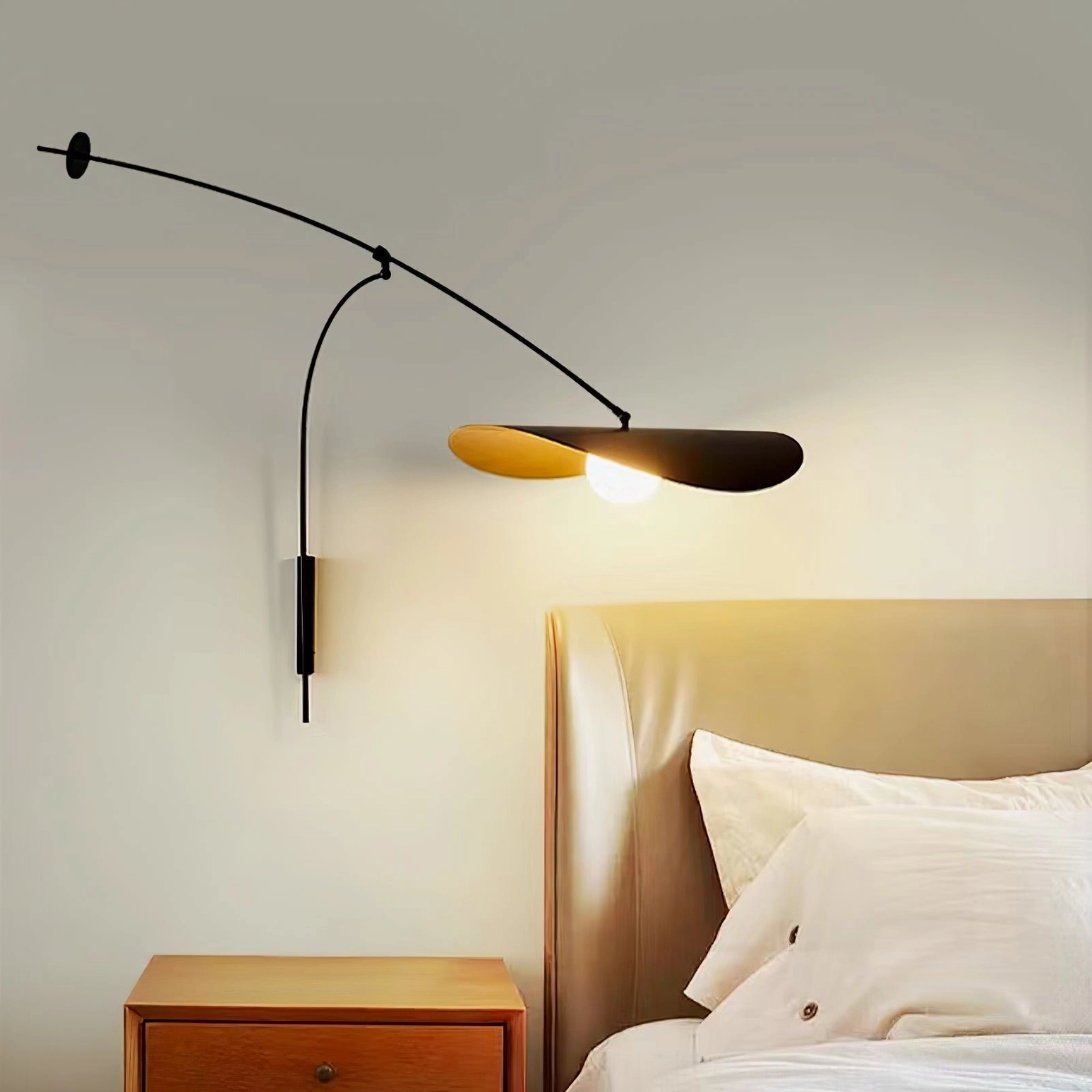 Myrna wall lamp beside wooden nightstand in modern bedroom, compact minimalist warm lighting
